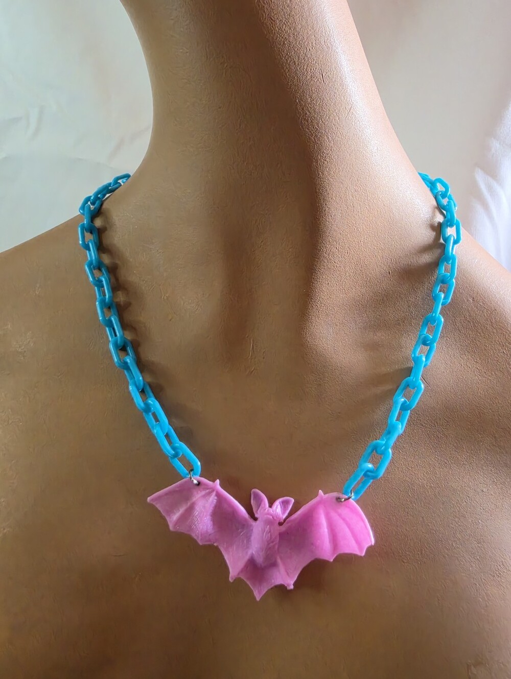Bright Blue Plastic Link with Pinky Purple Bat Necklace.
